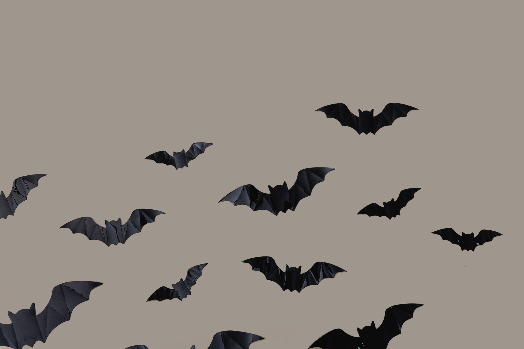 Black Bats on Brown Background