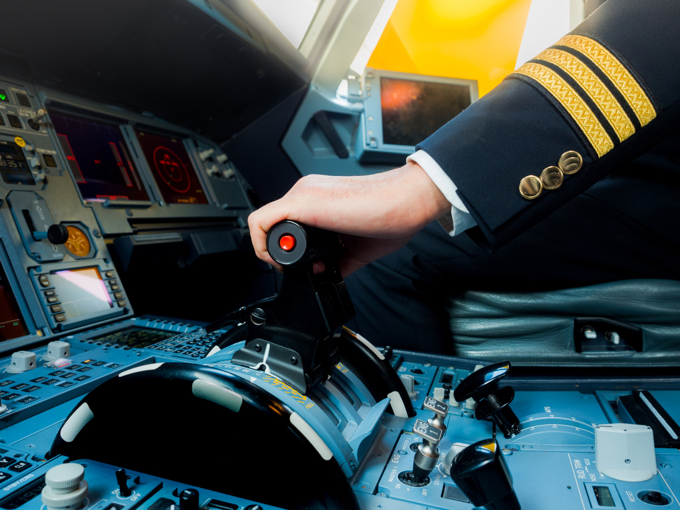 A Pilot hand is controlling plane to fly take off and landing